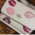CARTERA CON CAJA COACH