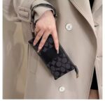 CARTERA DE MANO COACH/CAJA